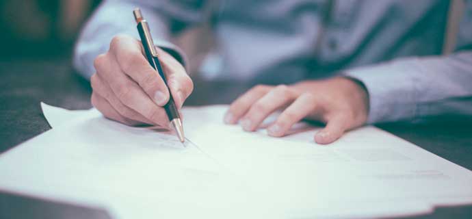 Healthcare Administrator Signing a Contract