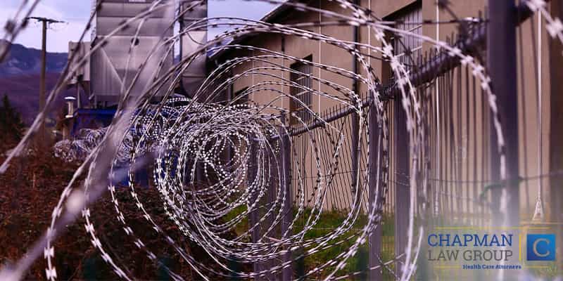 Image of barbwire outside of a prison.