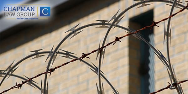 Image of barbed wired fence at a jail.