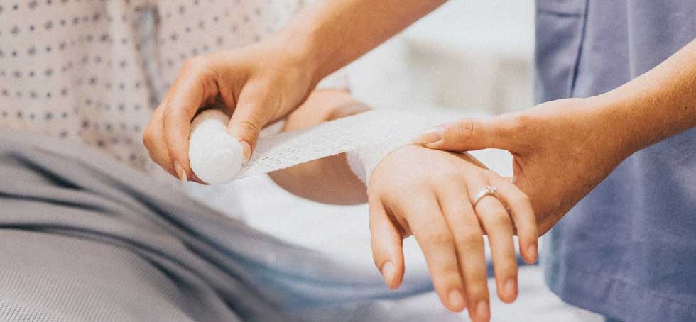 Nurse Bandaging a Patient at a Hospital
