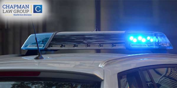 Image of a police car with flashing lights.