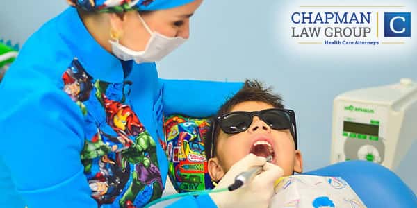 Image of a Dentist working on a child.