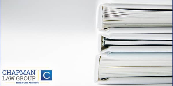 Image of a stack of books in reference to proper medial billing.