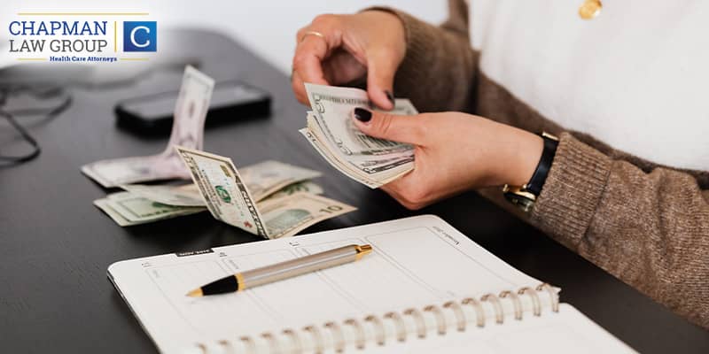 Physician paying an attorney a small amount of money representing how legal representation can benefit in self referral & stark law.